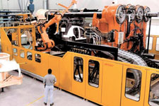 Husky products include hydraulic injection moulding machines with clamp forces from 50 to 8000 metric tons, moulds, hot runners, and removal robots